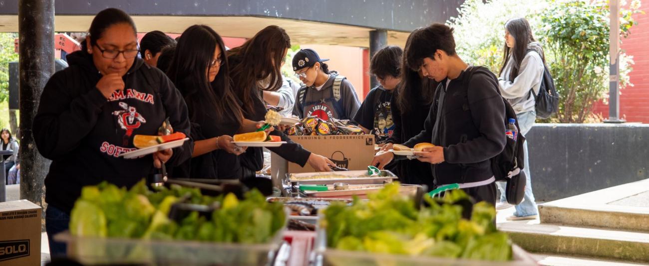 Students enjoy lunch outside at school.