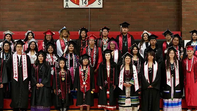 Students posing for a graduation photo