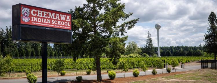 Chemawa Indian School sign with the school's name displayed prominently in bright colors.